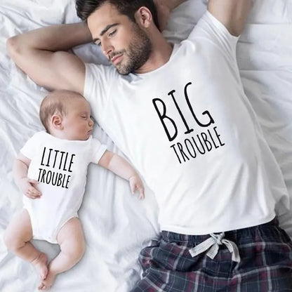 Father and baby in matching 'Big Trouble' and 'Little Trouble' shirts, cute family outfit