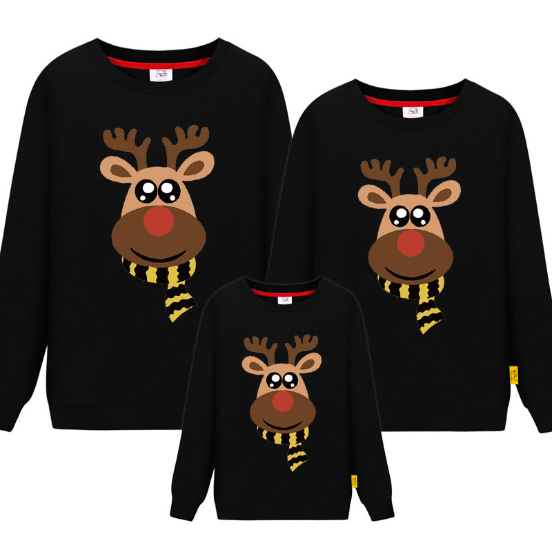 Black matching Christmas sweaters for families featuring a cute reindeer with a yellow and black scarf