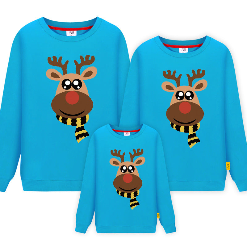 Blue matching family Christmas sweaters featuring a cute reindeer with a red nose and striped scarf design