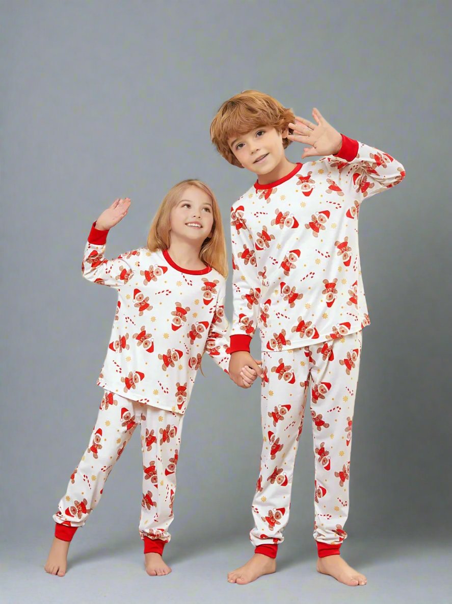 Matching family pajamas set with Santa and reindeer pattern on white, ideal for cozy holiday mornings