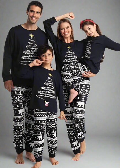 Christmas pajamas for family with red top featuring Christmas tree and polar bear pants