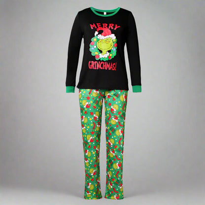 Festive 'Merry Grinchmas' pajamas for family with green pants decorated in holiday symbols