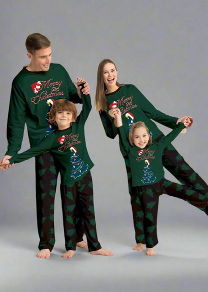 Family wearing cozy green Christmas pajamas with holiday trees, perfect for Christmas morning