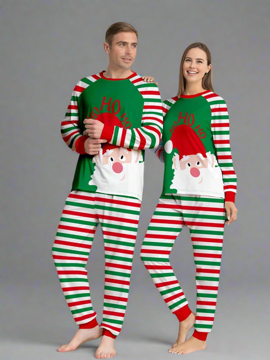 Cozy family Christmas pajamas with striped pattern and Santa Claus design, perfect for holiday photos