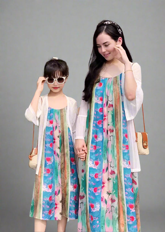 Mommy and daughter in matching colorful floral striped dresses