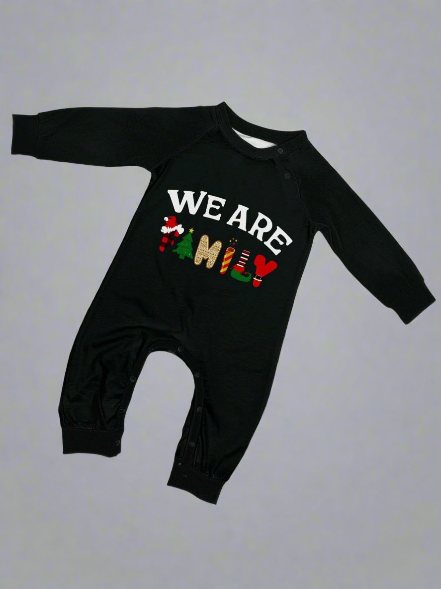 Festive matching family pajama set with black tops, checkered pants, and holiday theme