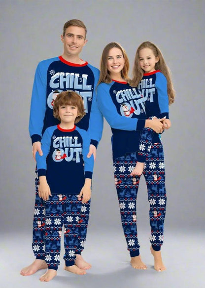 Family wearing matching 'Chill Out' Christmas pajamas with snowman and snowflake patter