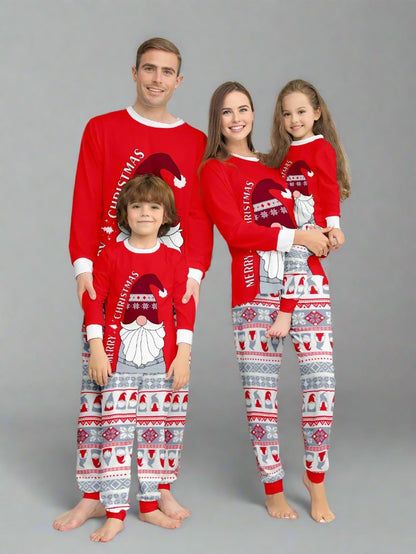 Family wearing matching Christmas pajamas with Santa design and festive red pattern