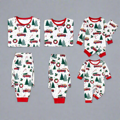 Festive red and green family pajamas with holiday truck and Christmas-themed print