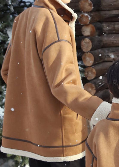 Happy family in warm matching shearling winter coats, perfect for a cozy and stylish outdoor snowy setting