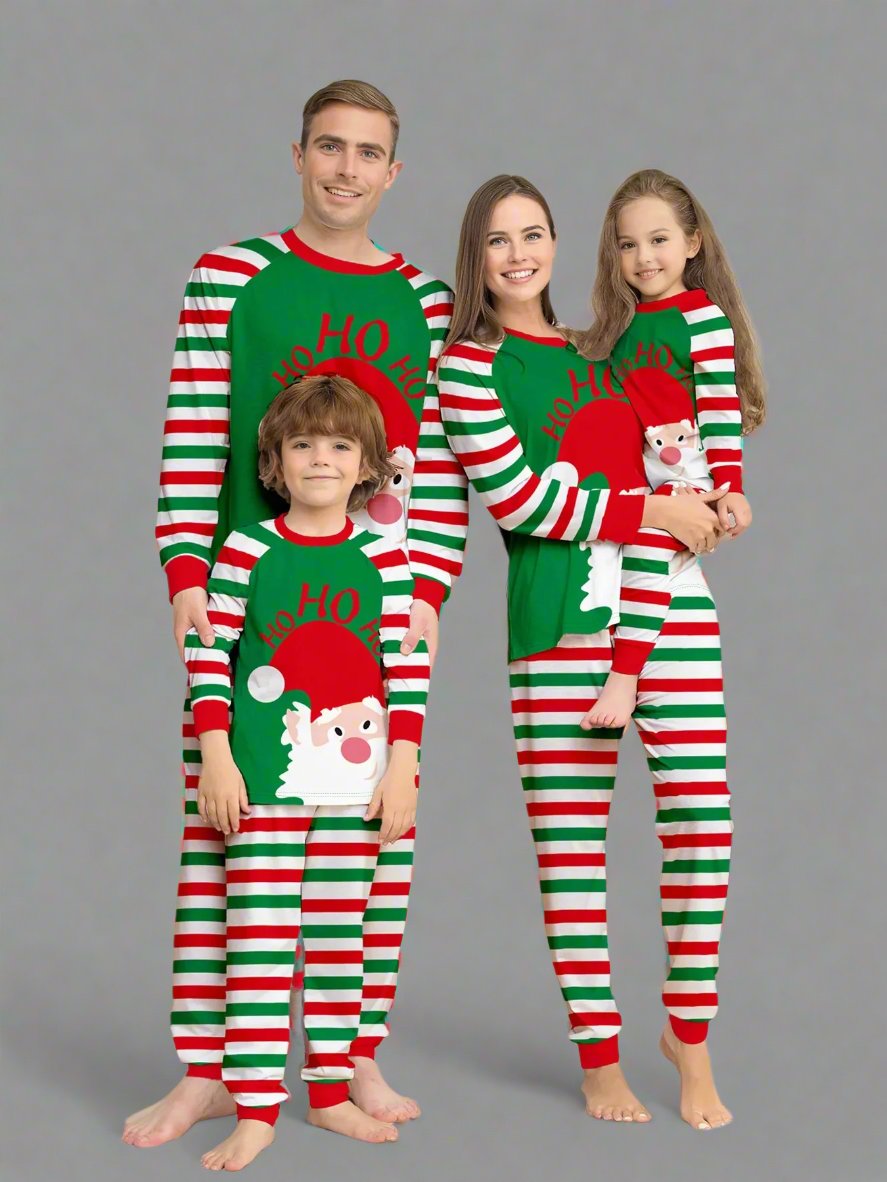 Family in matching red, green, and white striped Christmas pajamas with 'Ho Ho Ho' Santa design