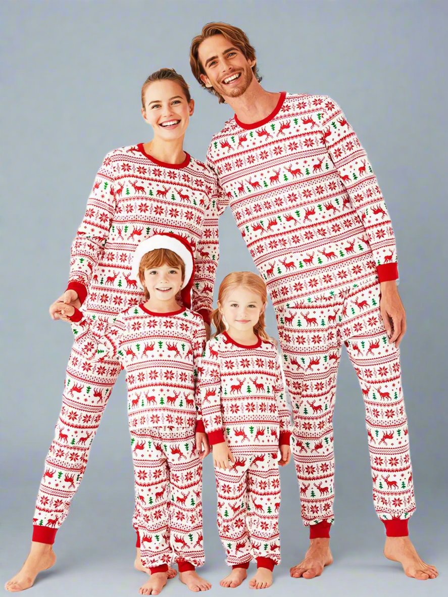 Matching family Christmas pajamas with red and green reindeer and snowflake pattern