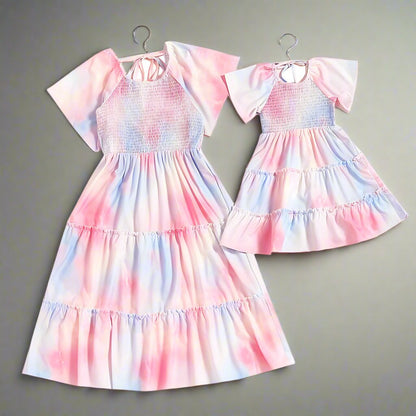 Mommy and me pastel tie-dye dresses, styled for family photos and special occasions