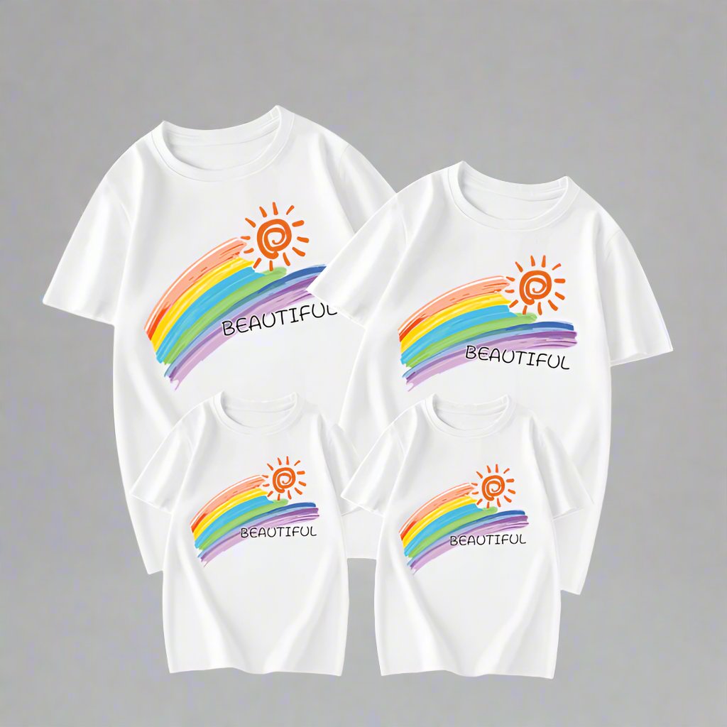 white family shirts with rainbow graphic and cheerful 'Beautiful' text