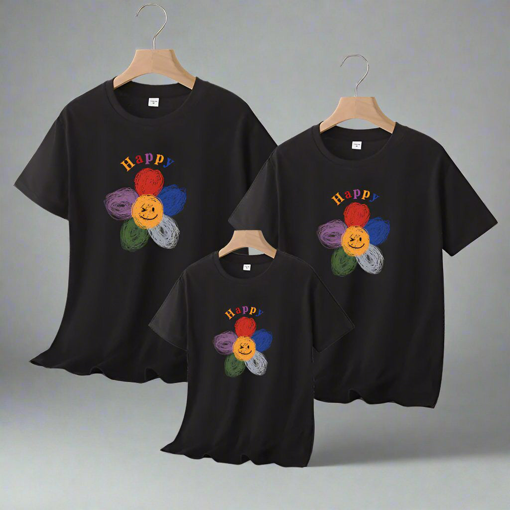 Family matching t-shirts with colorful hand-drawn flower and 'Happy' text