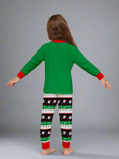 Cozy Christmas pajama set featuring dabbing Santa and festive patterns, perfect for family photos