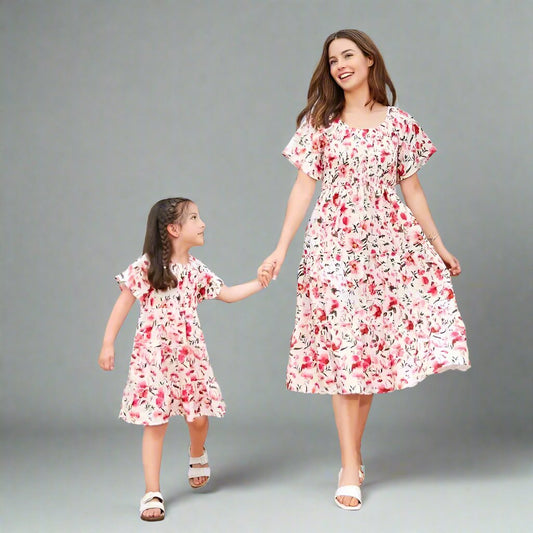 Family matching outfits: floral dresses for mother and daughter, ideal for sunny days