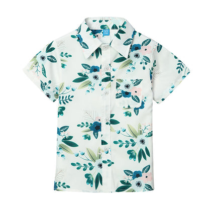 Matching family summer outfits with green and white floral designs, casual yet stylish