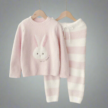 Matching family sleepwear in pink featuring a cute bunny print and striped bottoms