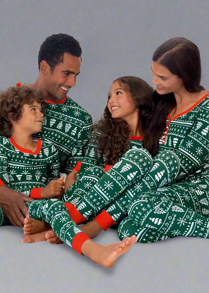 Green matching family Christmas pajamas with red trim and Nordic patter