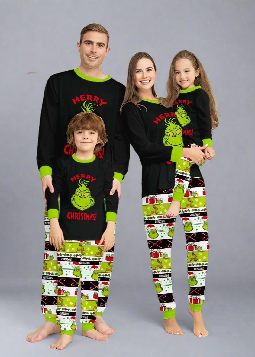 Matching family Christmas pajamas with Grinch design, black tops, and green festive patterned pants