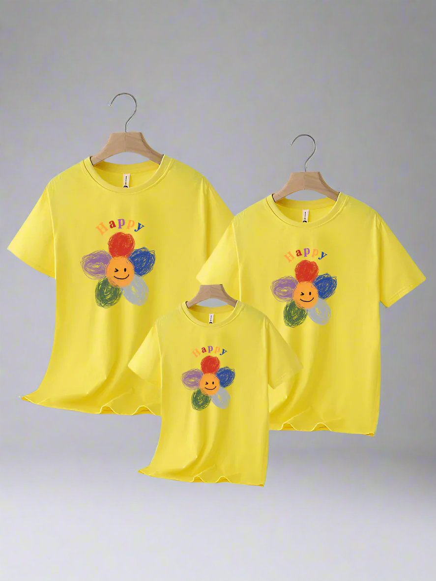 yellow family matching shirts with a happy, smiling flower design