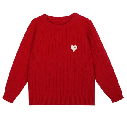 Family of four dressed in matching heart patch knit sweaters, featuring red, grey, white, and purple designs for special occasions