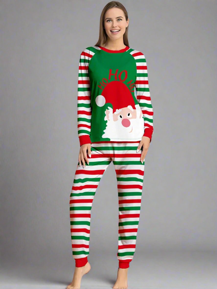 Matching family holiday pajamas with red, green, and white stripes and festive 'Ho Ho Ho' Santa print