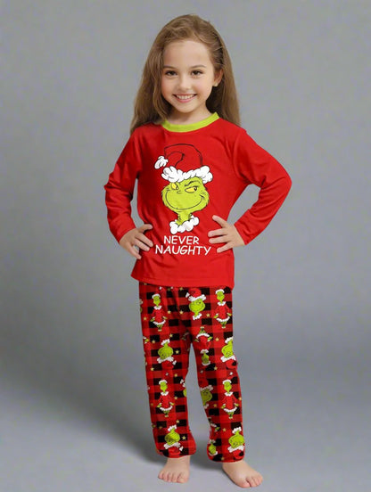 Cozy family holiday pajamas with Grinch design and red plaid pattern, perfect for Christmas gatherings