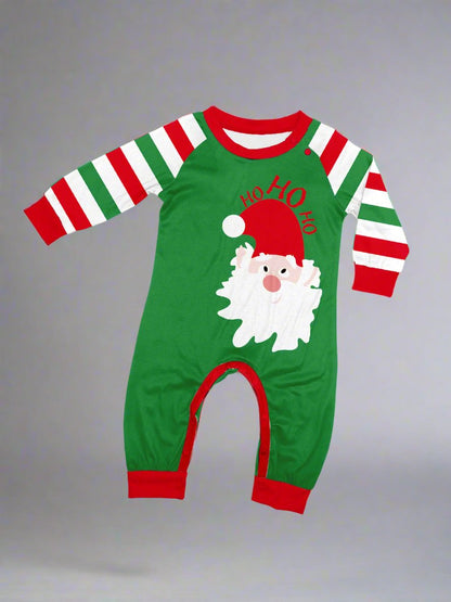 Family Christmas pajamas set with Santa face and red, green, white stripes for holiday festivitie