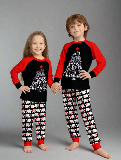 Festive family pajamas with holiday message shirts and polar bear patterned pants, in black and red