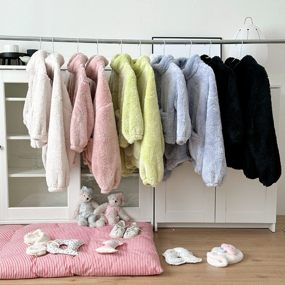 Mother and child in cozy, colorful matching loungewear sets, perfect for winter indoor comfort and family bonding