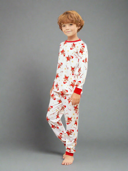 White family Christmas pajamas with red accents and playful Santa and reindeer print