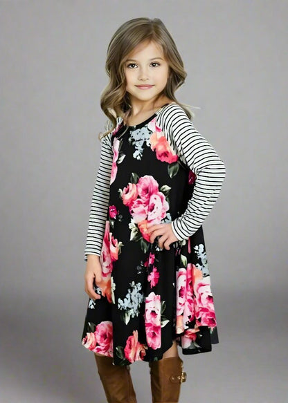 Matching black floral dresses with pink roses and striped sleeves for mommy and me, great for casual looks