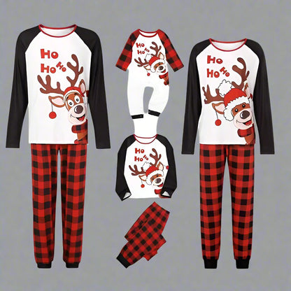 Matching family pajamas in red plaid with festive reindeer and Ho Ho Ho text