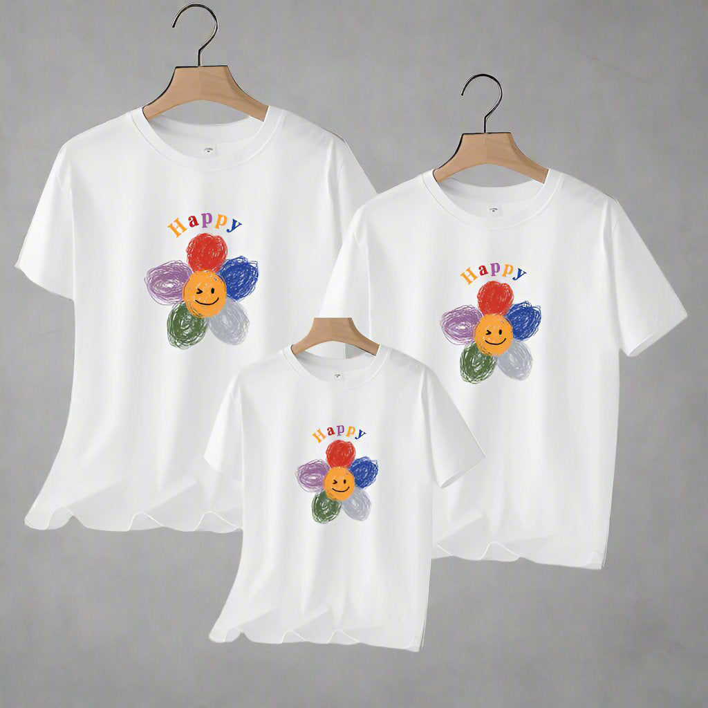 Coordinated family shirts featuring a cheerful, happy flower graphi