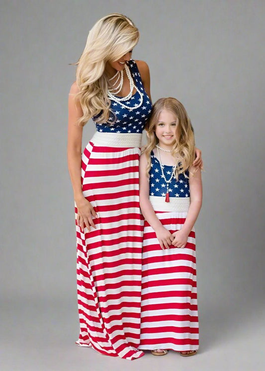 Matching patriotic American flag dresses for mother and daughter, perfect for 4th of July celebrations.