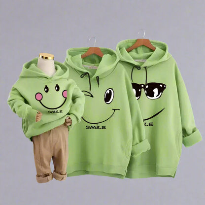 Fun and cheerful green smiley hoodies for family bonding