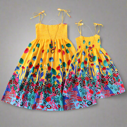 Matching yellow floral sundresses for mommy and daughter