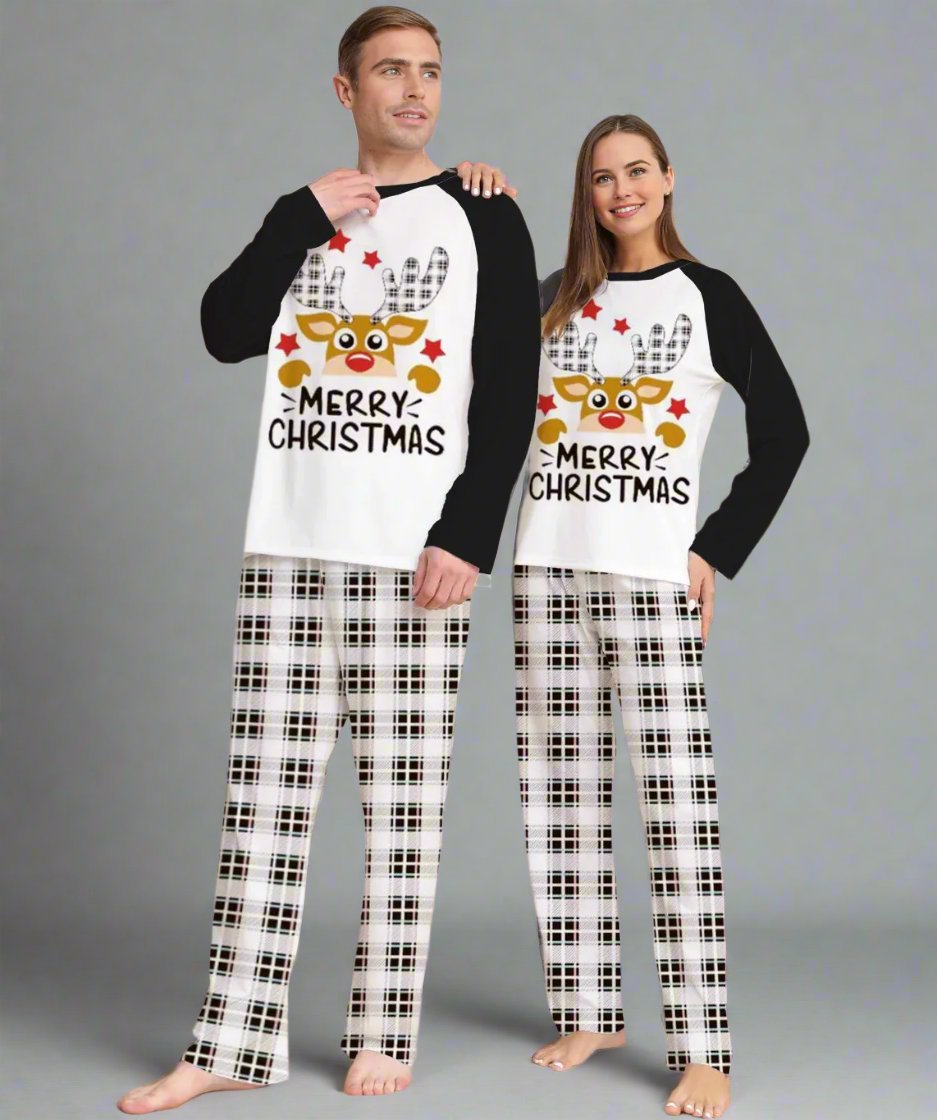 Matching family Christmas pajamas with reindeer design on tops and plaid bottoms, great for holiday celebrations