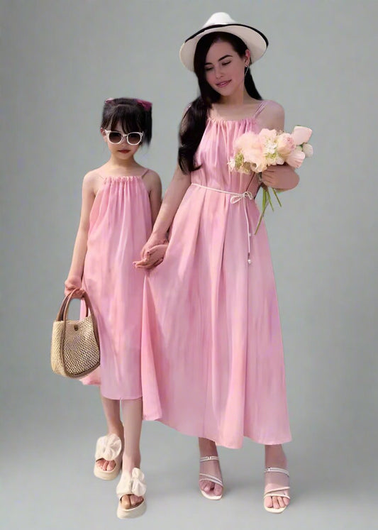 Mommy and me wearing matching pink dresses for summer