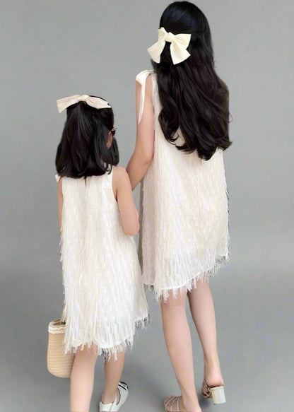 Stylish matching white fringe dresses for mother and daughter