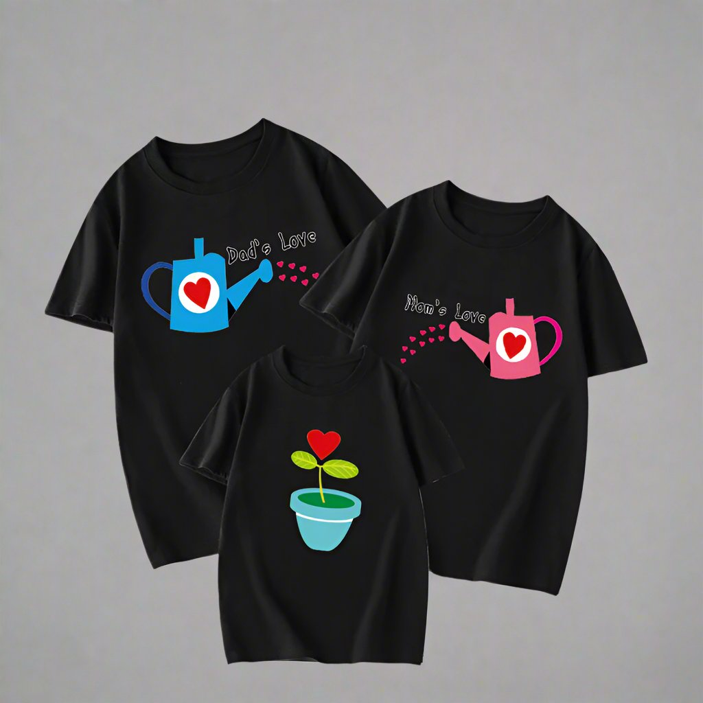 Matching family shirts with blue and pink watering cans symbolizing mom and dad’s love, plant graphic on child’s shirt