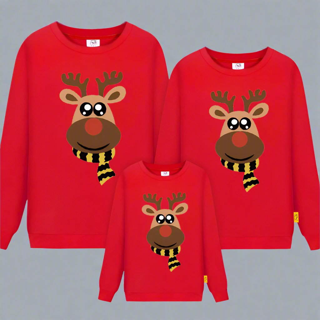 Red matching family Christmas sweaters featuring a festive reindeer with a striped scarf and smiling face