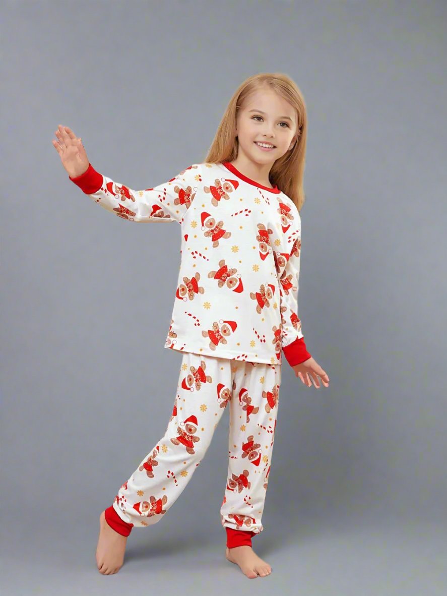 Family holiday pajamas set with festive Santa and reindeer pattern, perfect for Christmas gatherings