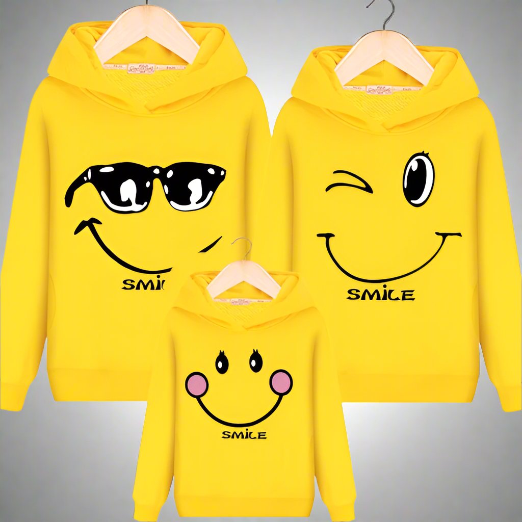 Bright yellow hoodies with smiley face designs, perfect for matching family outfits