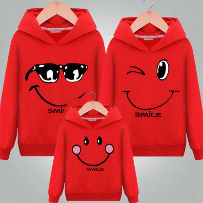 Matching red smiley face hoodies for the whole family with fun designs